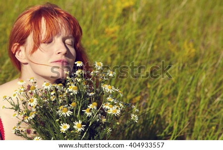 https://thumb10.shutterstock.com/display_pic_with_logo/996713/404933557/stock-photo-redhead-woman-with-a-bouquet-of-flowers-in-a-dress-outdoors-beautiful-stylish-romantic-young-girl-404933557.jpg